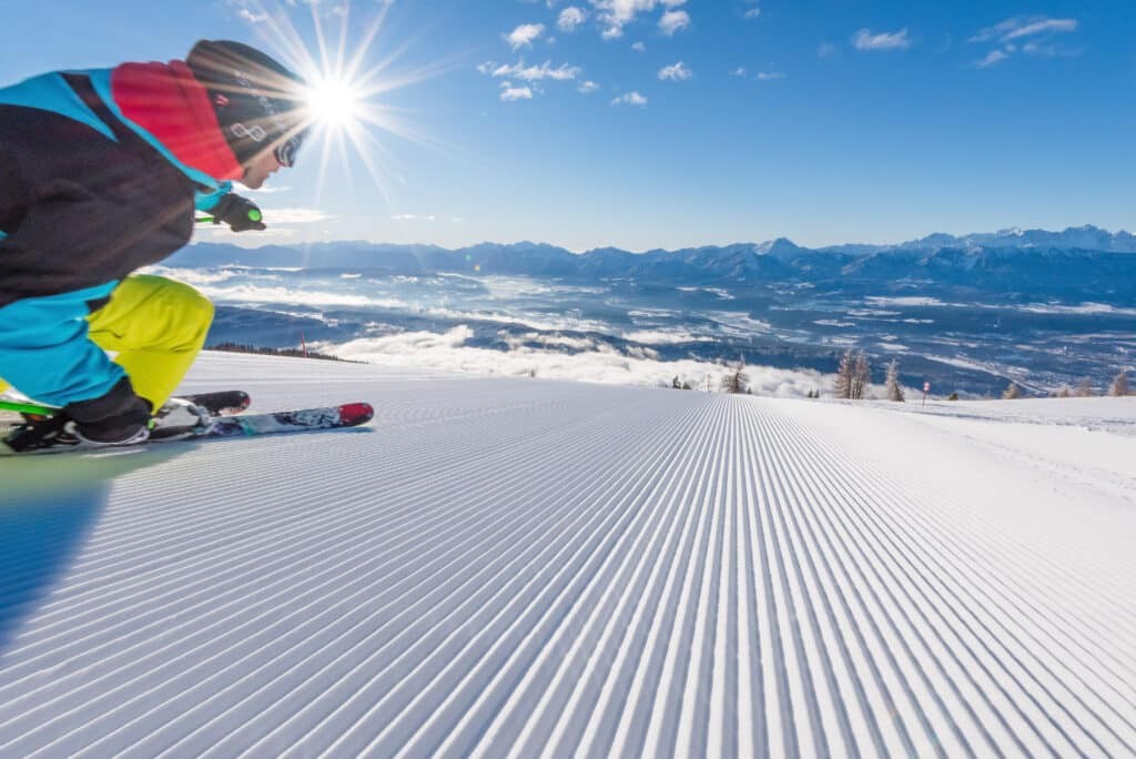 00000067886_Gerlitzen-Alpe-Skifahrer-Sonne_Region-Villach-Tourismus-GmbH_Michael-Stabentheiner